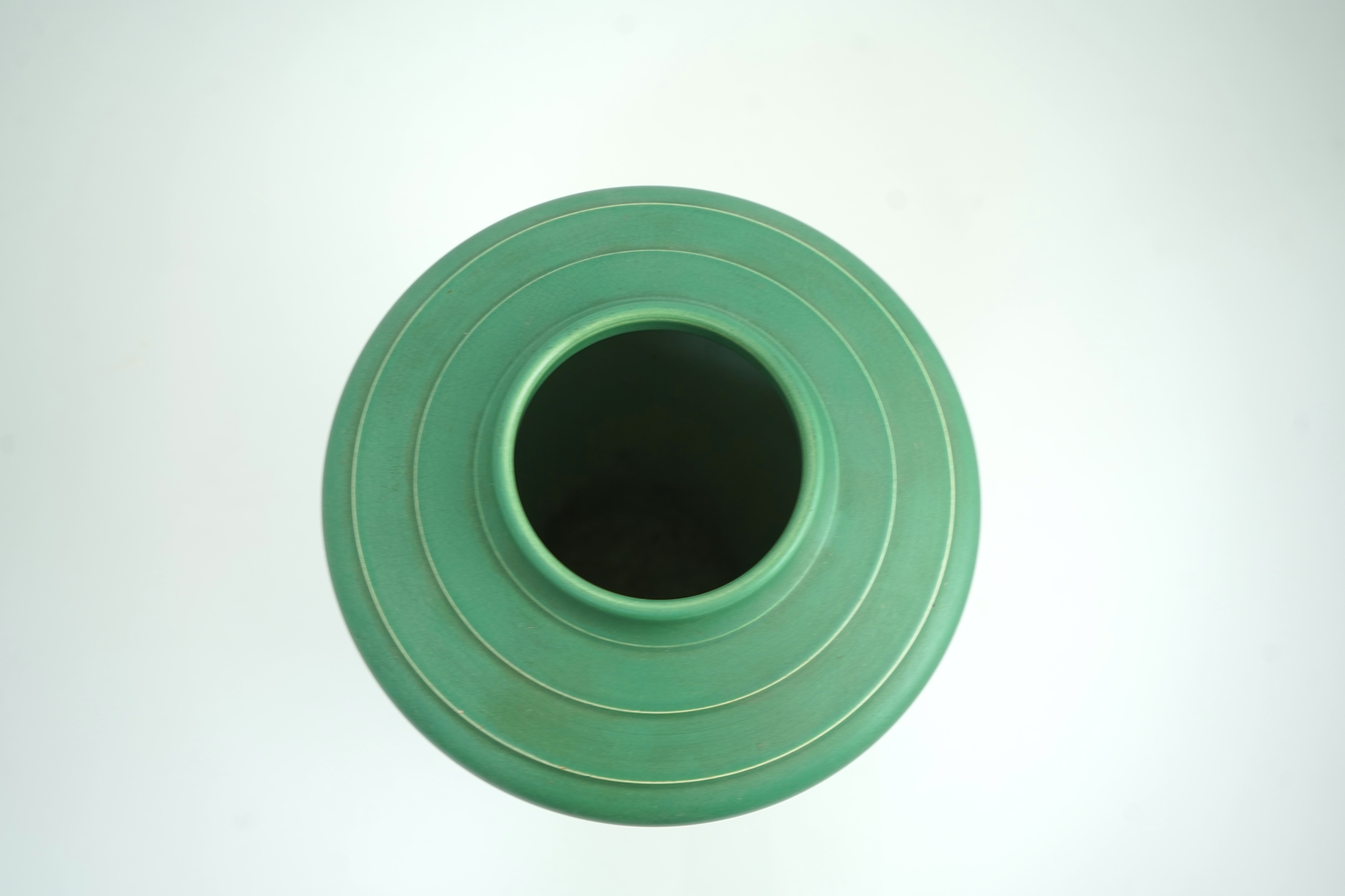 Keith Murray MC RDI FRIBA (New Zealand/British, 1892-1981) for Wedgwood: A matt green glazed tapering vase